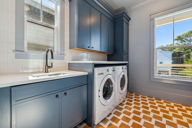 215 Buddy St, Santa Rosa Beach, FL 32459 - washroom featuring cabinet space, washer and dryer, ornamental molding, and brick patterned flooring