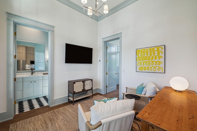 215 Buddy St, Santa Rosa Beach, FL 32459 - living area featuring wood finished floors, baseboards, and a chandelier