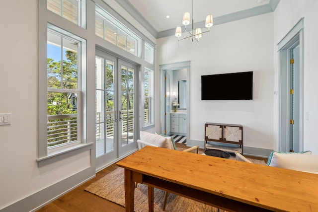215 Buddy St, Santa Rosa Beach, FL 32459 - home office with wood finished floors, a chandelier, baseboards, and ornamental molding