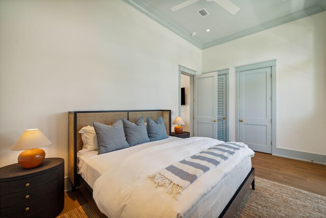 215 Buddy St, Santa Rosa Beach, FL 32459 - bedroom featuring wood finished floors, ornamental molding, and baseboards
