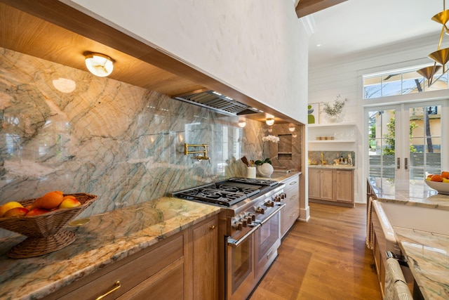 215 Buddy St, Santa Rosa Beach, FL 32459 - kitchen with double oven range, backsplash, light wood finished floors, french doors, and light stone countertops