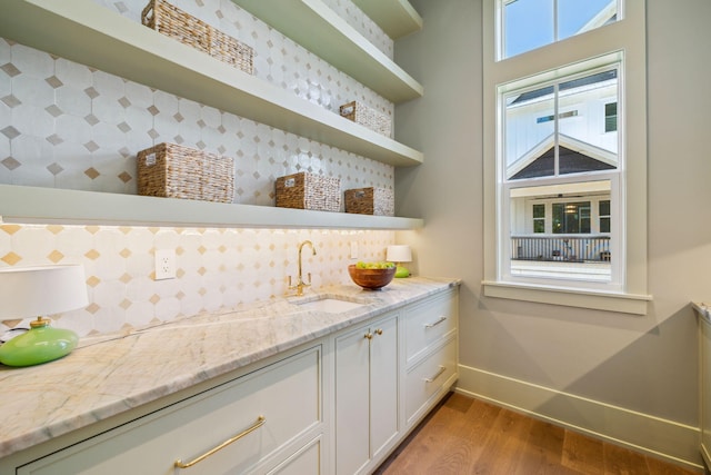 215 Buddy St, Santa Rosa Beach, FL 32459 - bar area with a sink, baseboards, wood finished floors, and tasteful backsplash