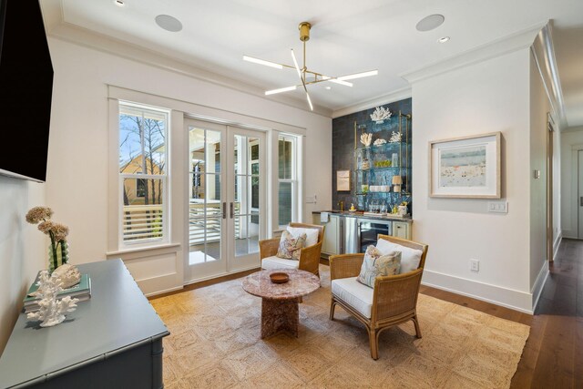 215 Buddy St, Santa Rosa Beach, FL 32459 - living area featuring french doors, crown molding, light wood finished floors, recessed lighting, and a dry bar