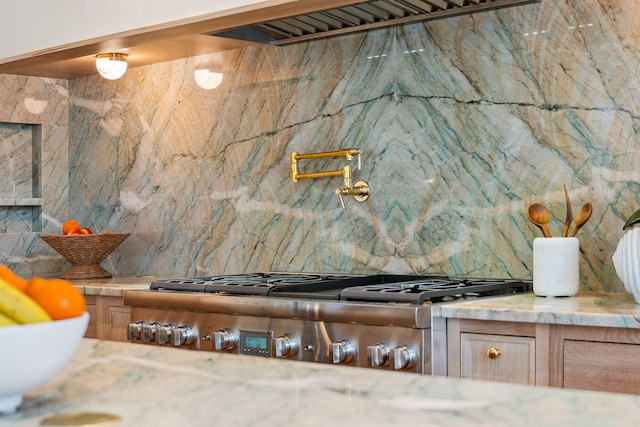 215 Buddy St, Santa Rosa Beach, FL 32459 - kitchen view of decorative backsplash, stainless steel gas cooktop, and pot filler