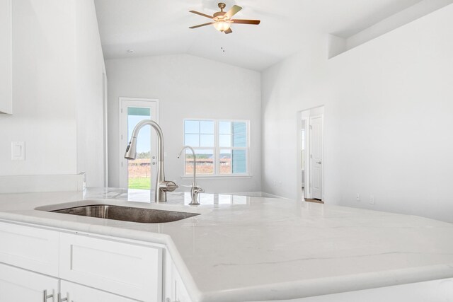 631 Alleyoak Ln Lot 16-2, Freeport, FL 32439 - kitchen with vaulted ceiling, sink, white cabinets, ceiling fan, and light stone countertops