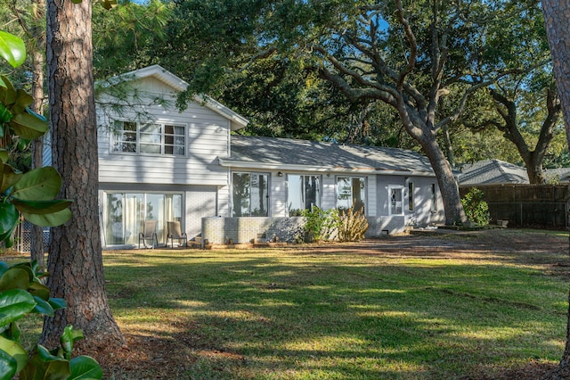 view of front of property with a front lawn