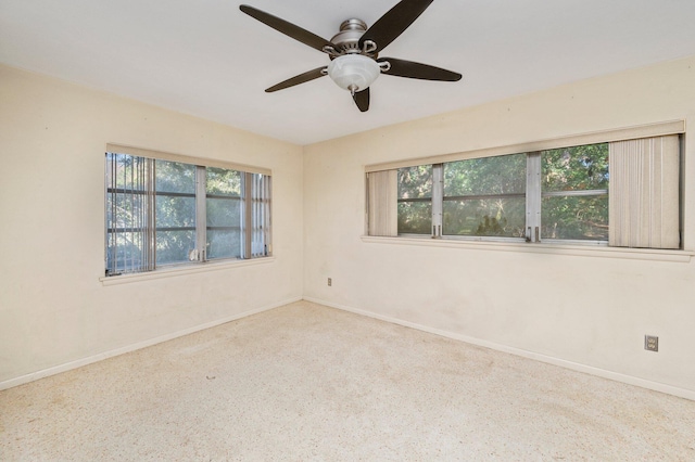 unfurnished room with ceiling fan