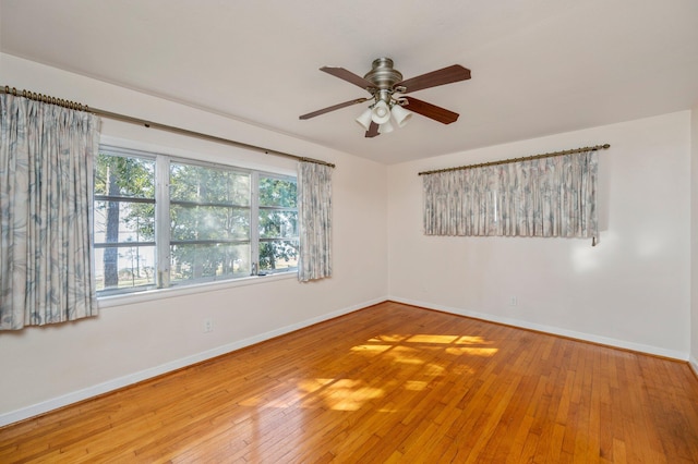 unfurnished room featuring hardwood / wood-style flooring and ceiling fan