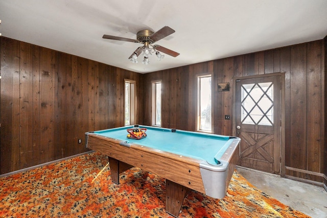 recreation room featuring pool table, ceiling fan, and wood walls