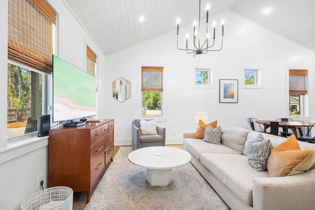 living room with lofted ceiling, light wood finished floors, and an inviting chandelier