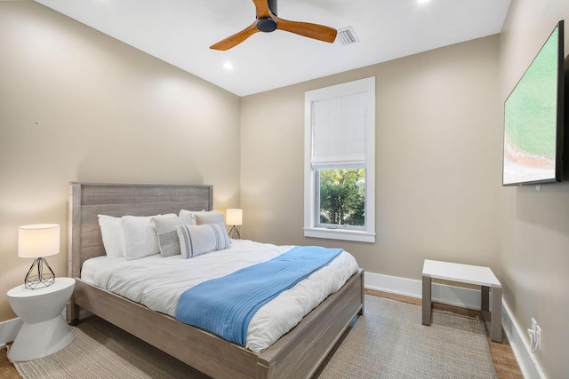 bedroom with light wood-style floors, recessed lighting, visible vents, and baseboards