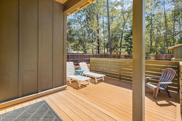 wooden deck featuring a fenced backyard