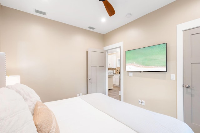 bedroom with ceiling fan and visible vents