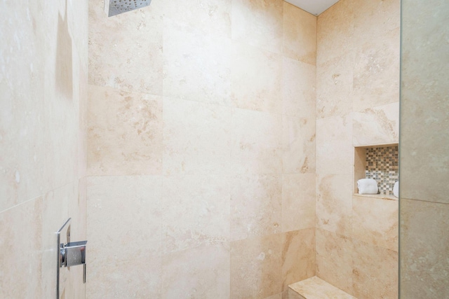 bathroom with a tile shower