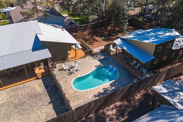 view of swimming pool featuring a fenced in pool, a patio area, and a fenced backyard