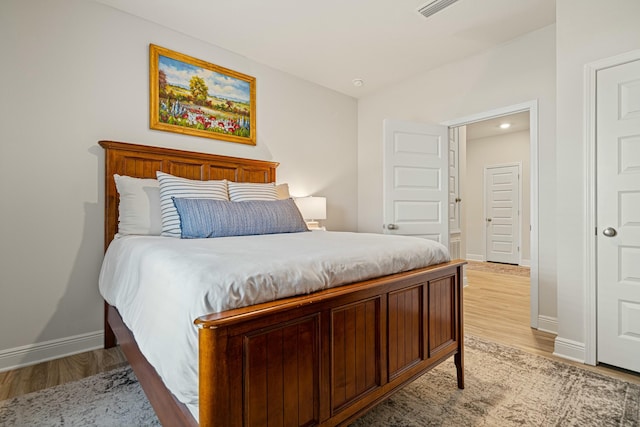 bedroom with light wood-type flooring