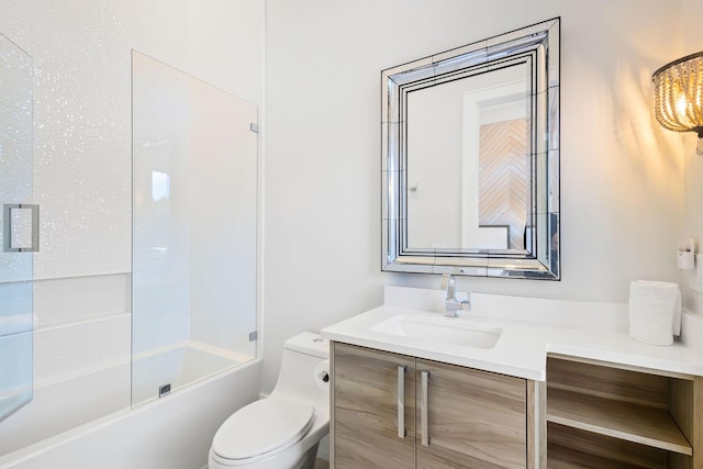 full bathroom with vanity, toilet, and enclosed tub / shower combo