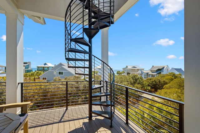 wooden terrace featuring a residential view