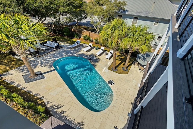 view of pool featuring a patio area, a fenced in pool, and a fenced backyard