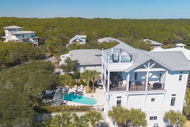 drone / aerial view with a view of trees