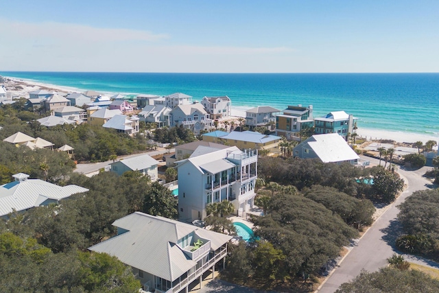 aerial view featuring a residential view, a water view, and a beach view