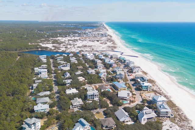 bird's eye view with a beach view and a water view