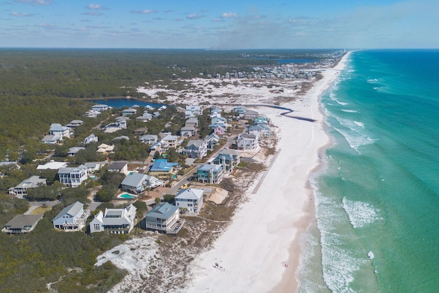 birds eye view of property with a view of the beach and a water view