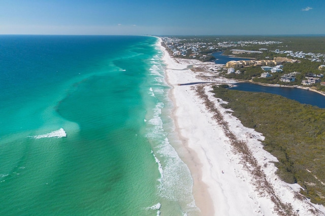 bird's eye view featuring a view of the beach and a water view