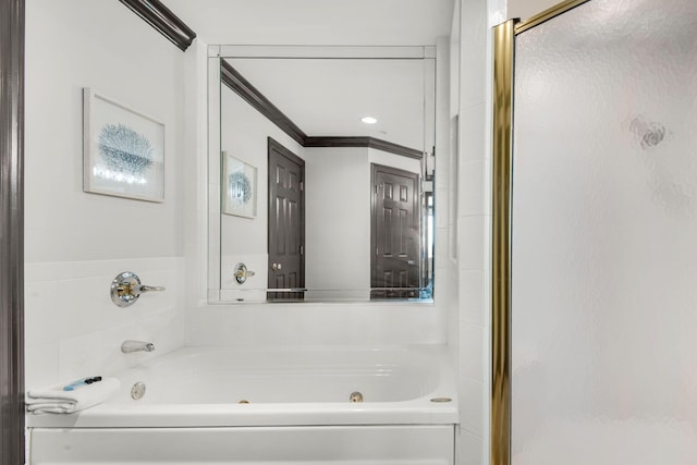 full bath with crown molding, a jetted tub, and a shower stall