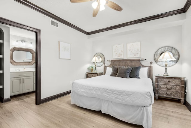 bedroom with baseboards, visible vents, ensuite bath, crown molding, and light wood-style floors