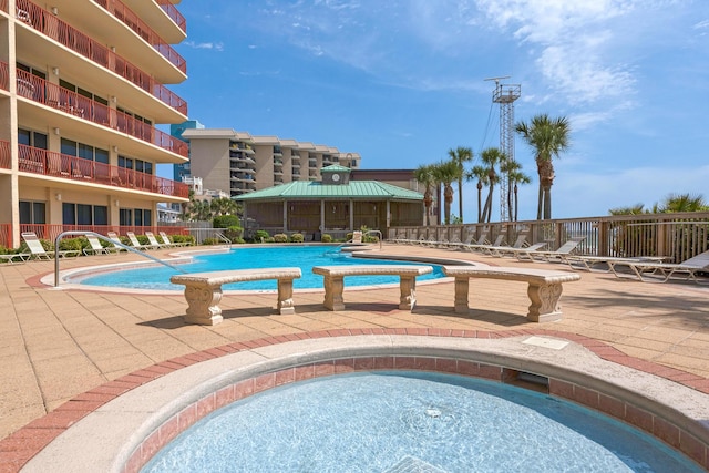 pool featuring a patio area and fence