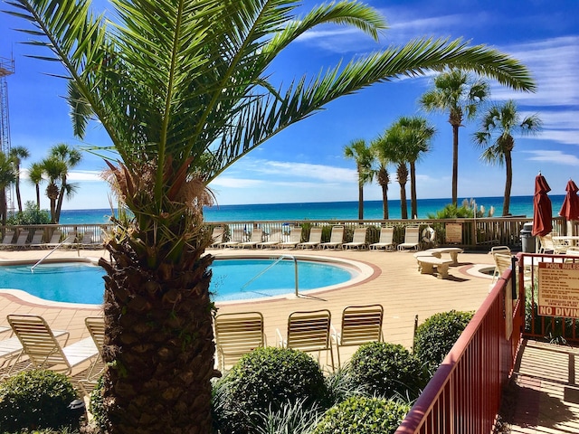 view of pool with a water view