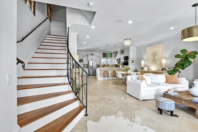 living area with stairway and recessed lighting