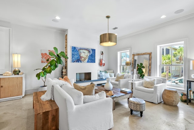 living area with visible vents, crown molding, concrete floors, a fireplace, and recessed lighting