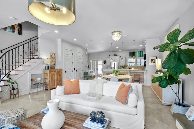 living room featuring crown molding, finished concrete flooring, recessed lighting, baseboards, and stairs