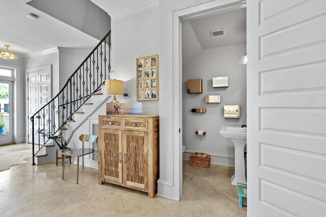 interior space featuring ornamental molding, stairway, visible vents, and baseboards