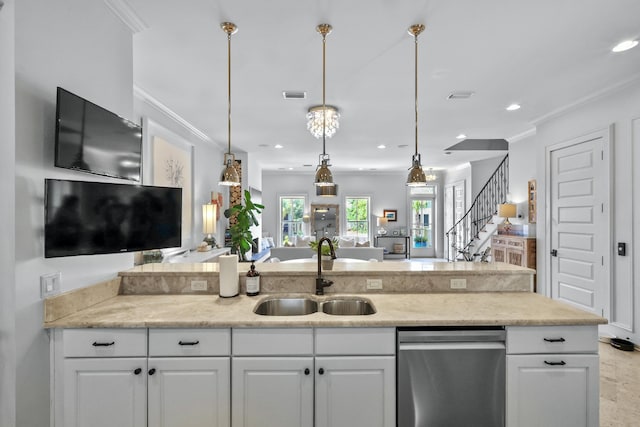 kitchen with visible vents, stainless steel dishwasher, ornamental molding, white cabinets, and a sink