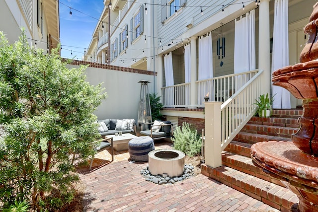 view of patio with covered porch and fence