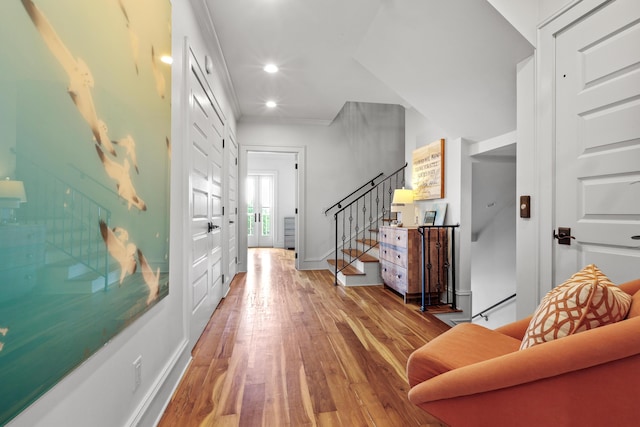 entrance foyer with stairs, baseboards, wood finished floors, and recessed lighting