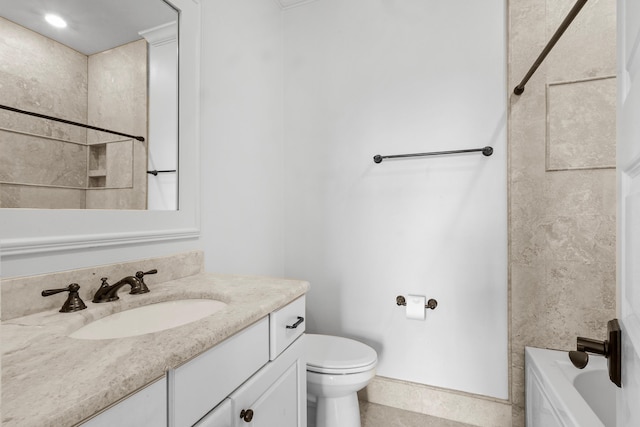 bathroom with toilet, tile patterned flooring, baseboards, and vanity