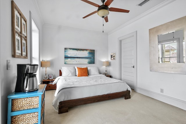 bedroom featuring baseboards, visible vents, ceiling fan, carpet, and crown molding