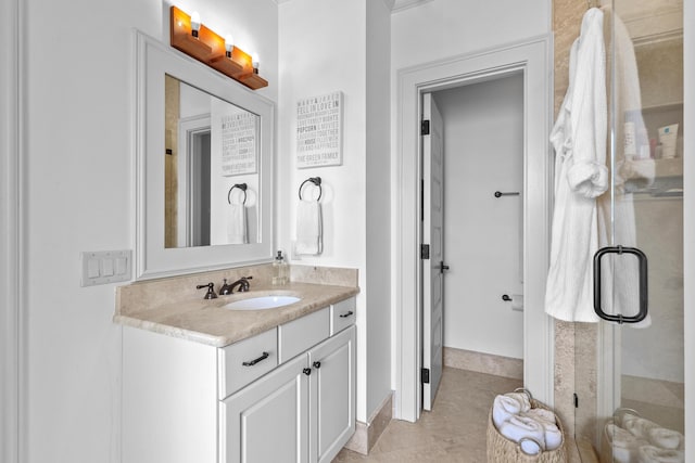 full bath with a stall shower, tile patterned flooring, and vanity