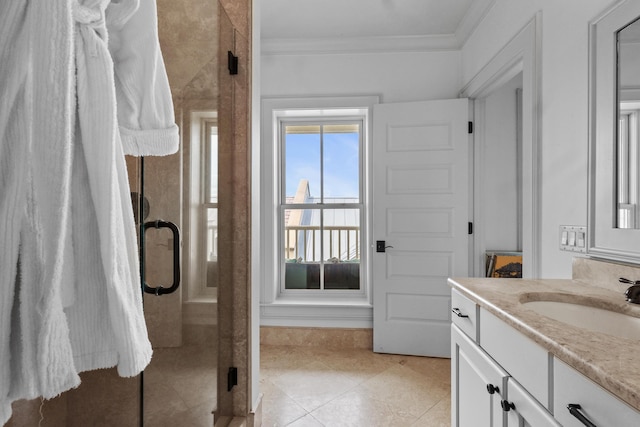 bathroom featuring ornamental molding, tile patterned flooring, vanity, and an enclosed shower