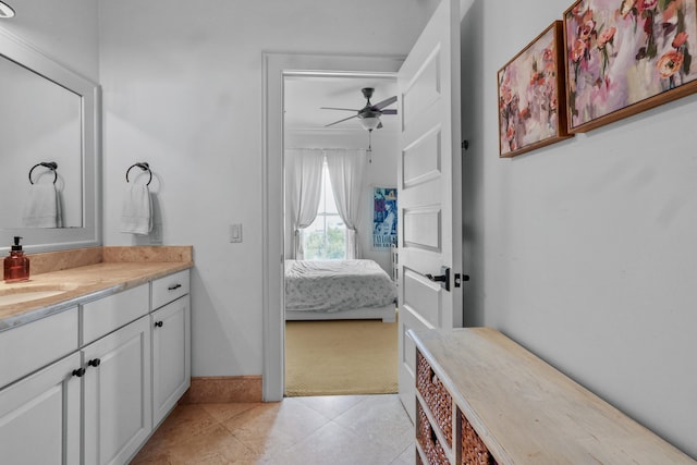 bathroom featuring ensuite bath, tile patterned flooring, a ceiling fan, and vanity