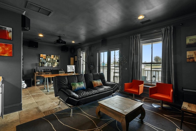 living area featuring french doors, visible vents, and crown molding