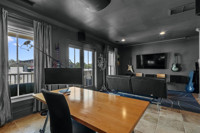 dining area featuring ornamental molding, visible vents, plenty of natural light, and stone tile floors