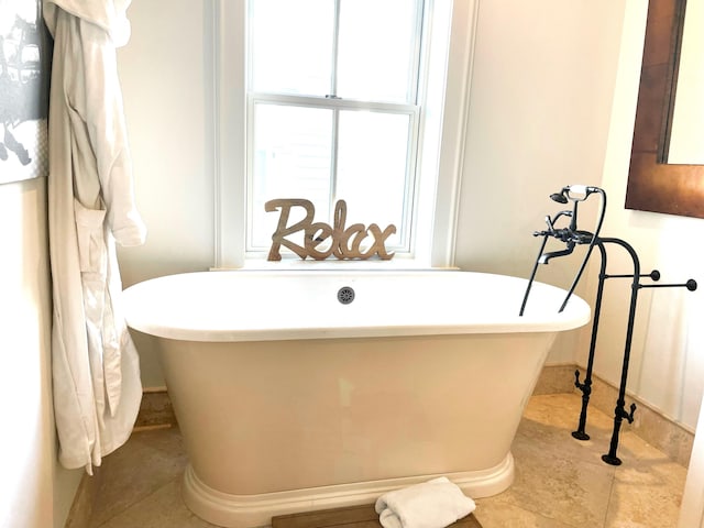 full bathroom with a freestanding tub