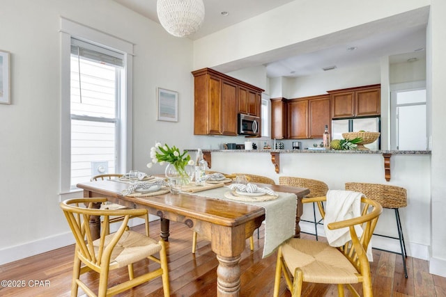 115 Cottage Ct, Panama City Beach, FL 32413 - dining area featuring wood-type flooring