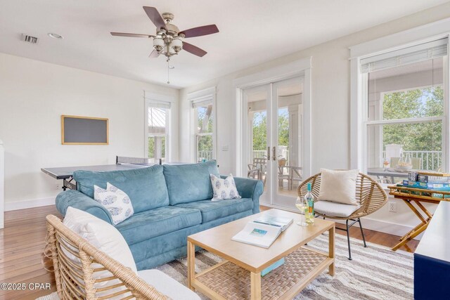 115 Cottage Ct, Panama City Beach, FL 32413 - living room with ceiling fan, light wood-type flooring, and french doors