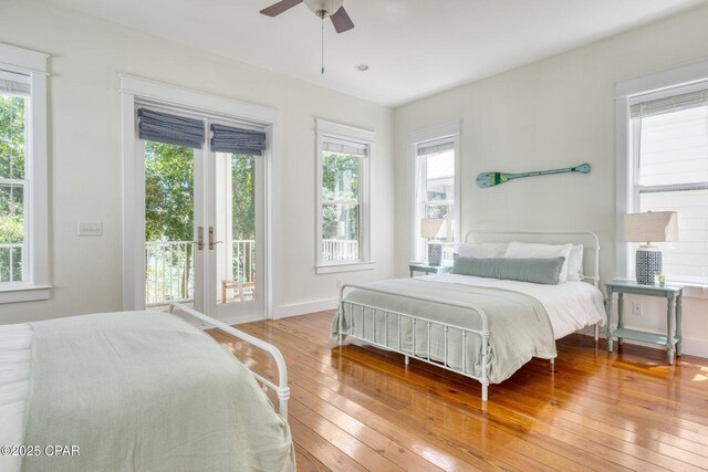 115 Cottage Ct, Panama City Beach, FL 32413 - bedroom with multiple windows, access to exterior, ceiling fan, and light wood-type flooring